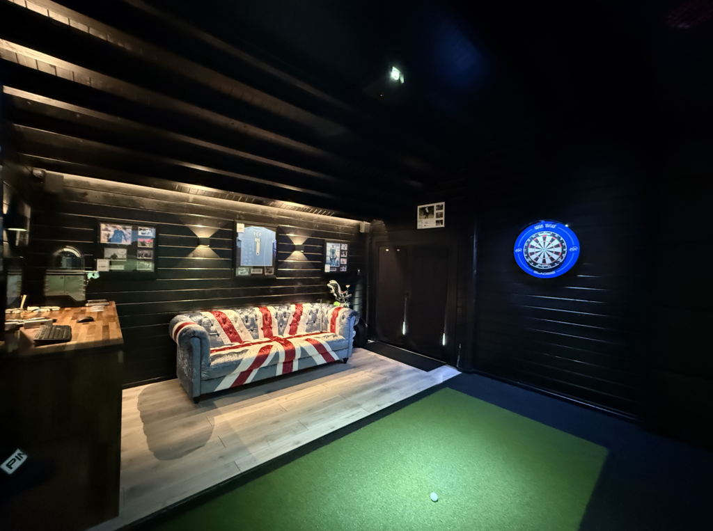Tekden The Legend Golf Simulator Room from the back of room with Sofa